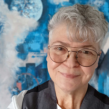 Lillian Cozart posing with abstract painting